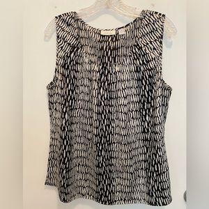 Used Chico’s sleeveless black & beige sleeveless blouse. Size 2(12)